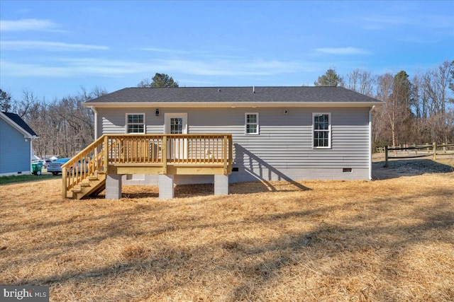 back of property featuring crawl space, a yard, fence, and a wooden deck