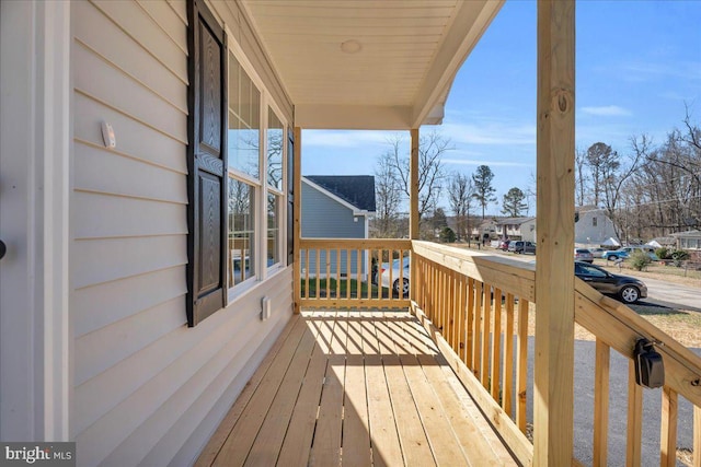 wooden terrace with a residential view