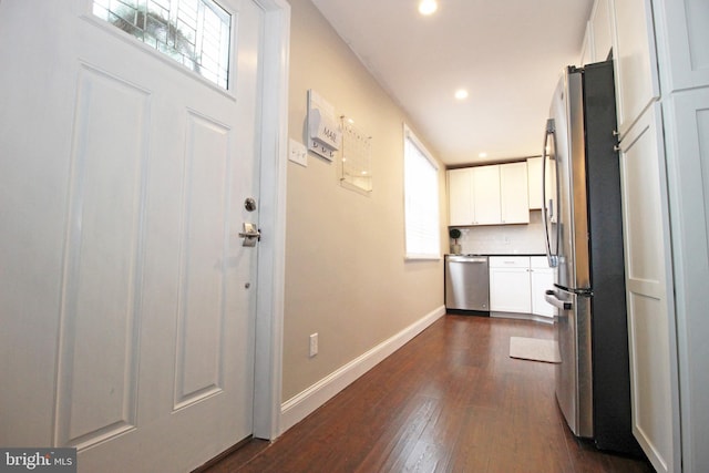 interior space featuring dark wood-style floors, recessed lighting, and baseboards