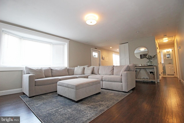 living room with dark wood-style floors and baseboards