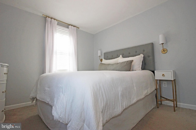 carpeted bedroom with baseboards