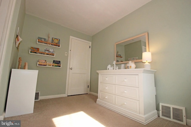 bedroom featuring light carpet, baseboards, and visible vents