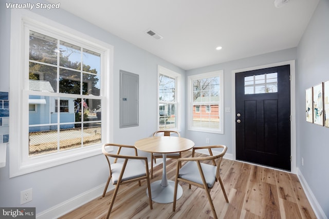 entrance foyer with light wood finished floors, recessed lighting, visible vents, electric panel, and baseboards