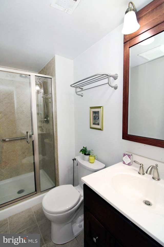 full bathroom with visible vents, toilet, a stall shower, tile patterned floors, and vanity