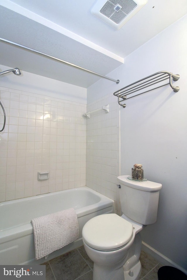 bathroom featuring visible vents, toilet, tile patterned flooring, shower / bath combination, and baseboards