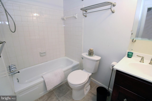 bathroom with tub / shower combination, baseboards, toilet, tile patterned floors, and vanity