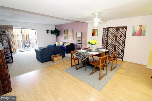 dining space featuring wood finished floors and a ceiling fan