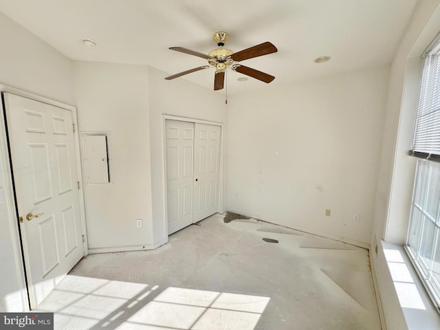 unfurnished bedroom featuring a closet, a ceiling fan, and unfinished concrete flooring