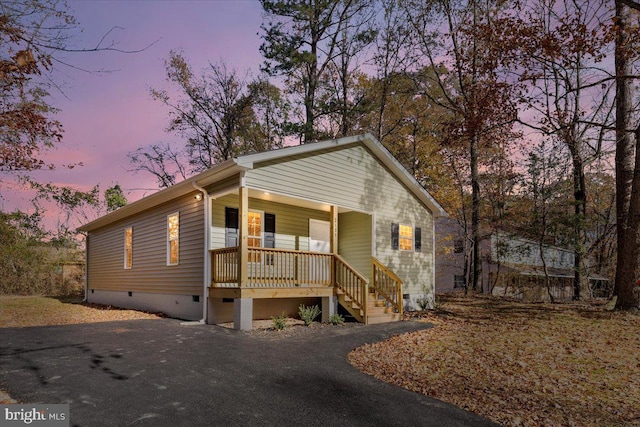 view of front of home with crawl space and covered porch