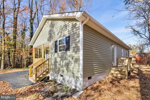 view of property exterior featuring crawl space