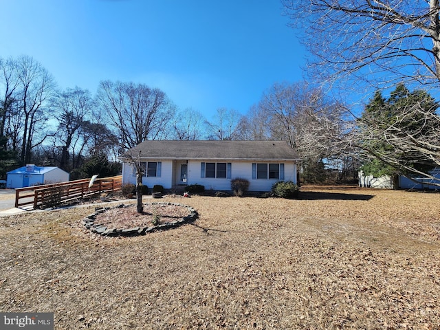 single story home with fence