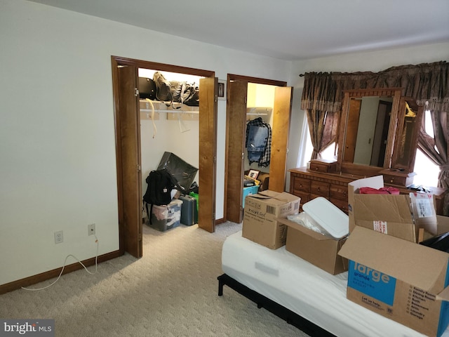 unfurnished bedroom featuring carpet floors and baseboards