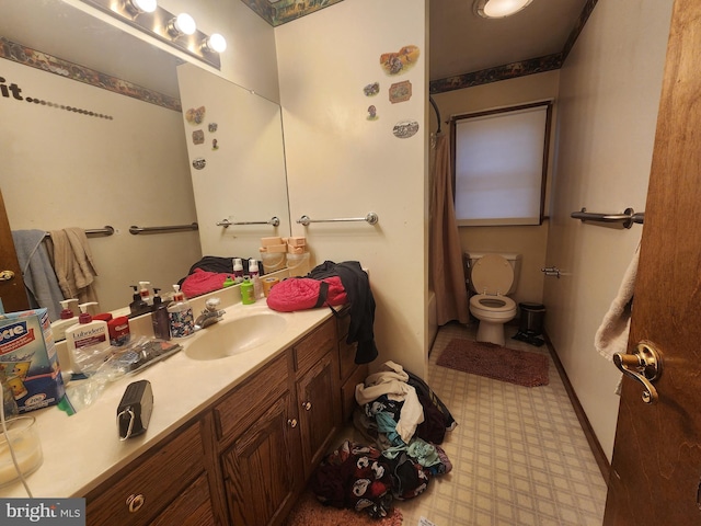 full bath featuring toilet, curtained shower, vanity, and tile patterned floors