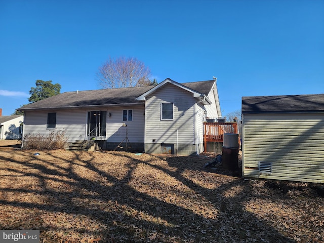 rear view of house with entry steps