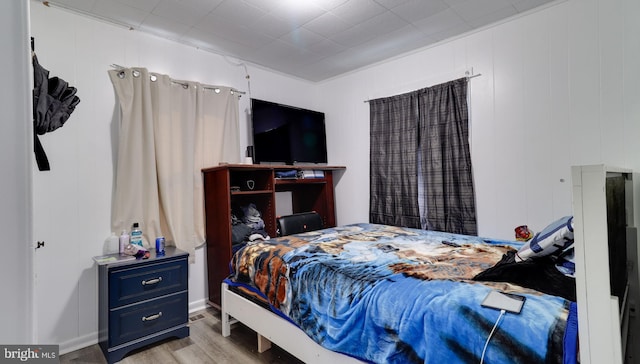 bedroom with wood finished floors