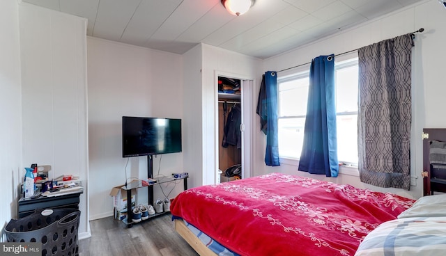 bedroom with a closet and wood finished floors