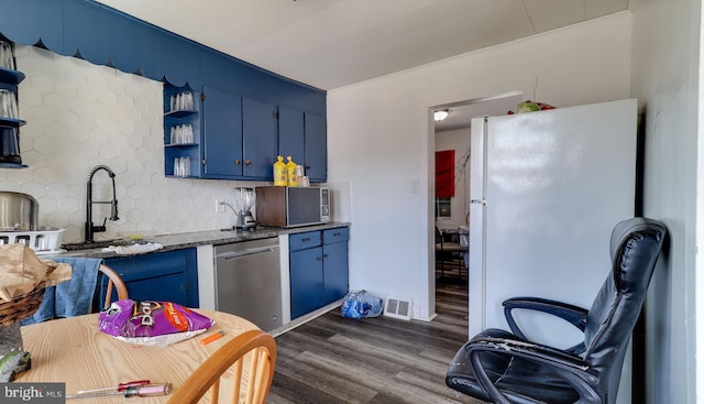 kitchen with appliances with stainless steel finishes, visible vents, blue cabinetry, and open shelves