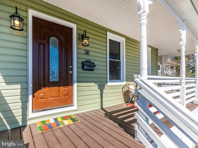 property entrance featuring covered porch