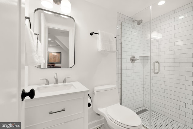 bathroom featuring visible vents, a stall shower, vanity, and toilet