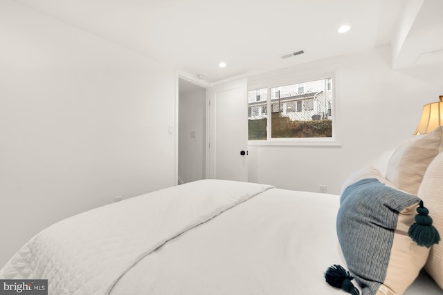 bedroom with recessed lighting and visible vents