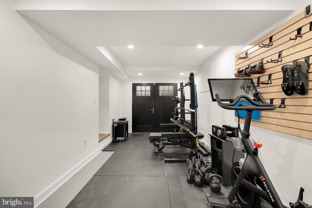 workout area featuring recessed lighting and baseboards