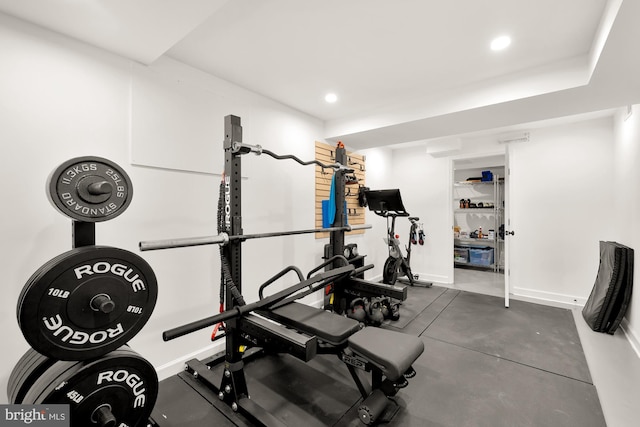 workout area with baseboards and recessed lighting