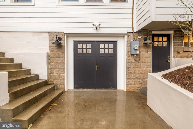 entrance to property featuring stone siding