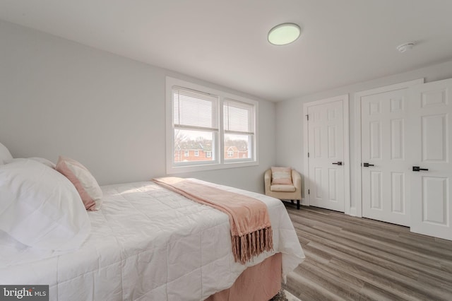 bedroom featuring wood finished floors