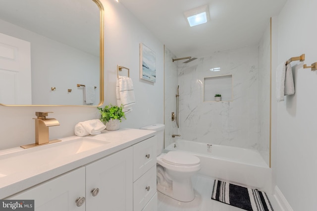 bathroom featuring bathtub / shower combination, vanity, and toilet