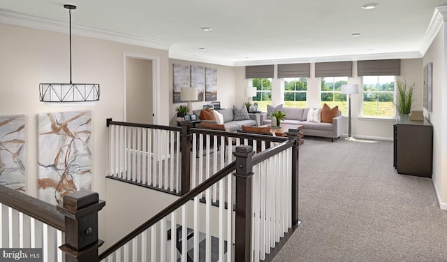 hallway featuring baseboards, carpet flooring, an upstairs landing, and crown molding