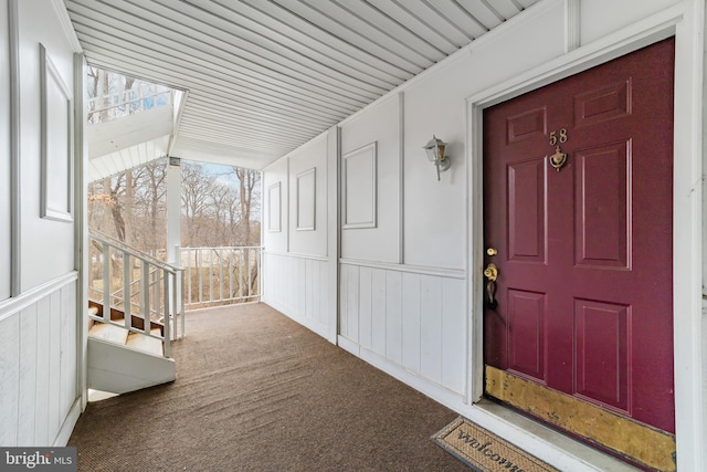 doorway to property featuring covered porch