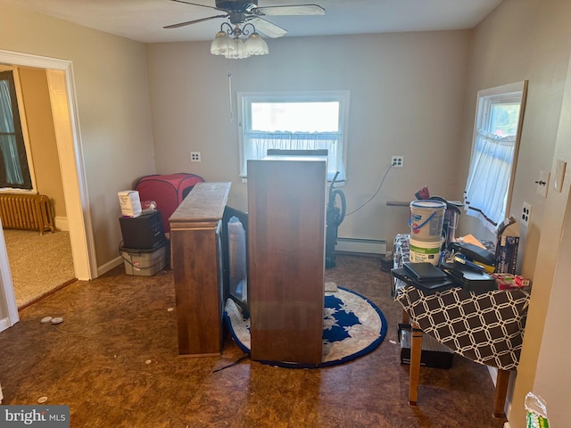 office featuring ceiling fan, radiator heating unit, baseboard heating, and baseboards