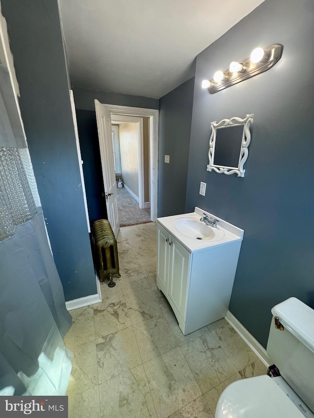 full bathroom with marble finish floor, baseboards, vanity, and toilet