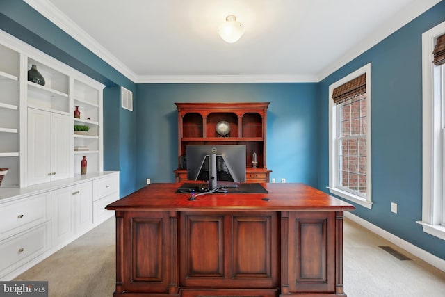 office area with baseboards, crown molding, visible vents, and light colored carpet