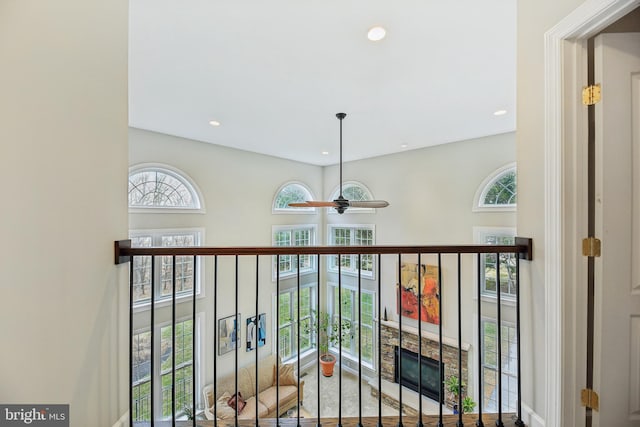 hallway featuring a wealth of natural light and recessed lighting