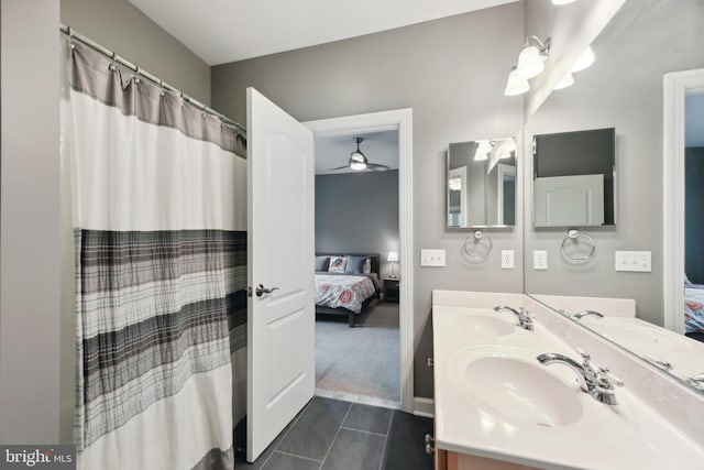 full bathroom featuring tile patterned flooring, a sink, ensuite bath, and double vanity