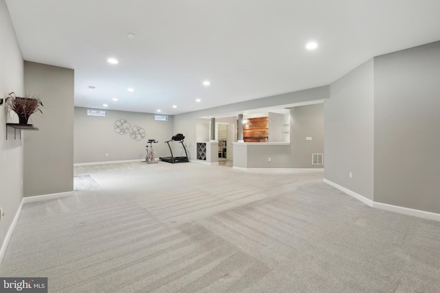 workout room with light colored carpet, visible vents, baseboards, and recessed lighting