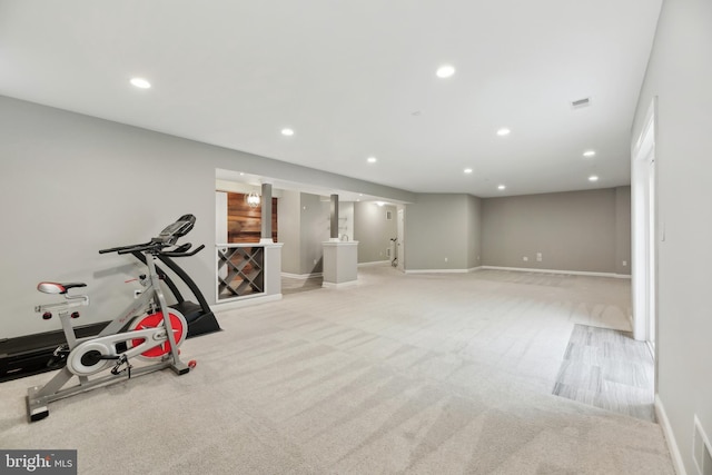 workout room featuring carpet floors, baseboards, and recessed lighting