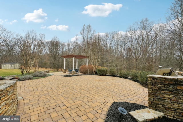 view of patio / terrace featuring an outdoor structure