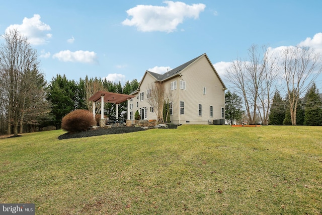 view of property exterior with cooling unit and a yard