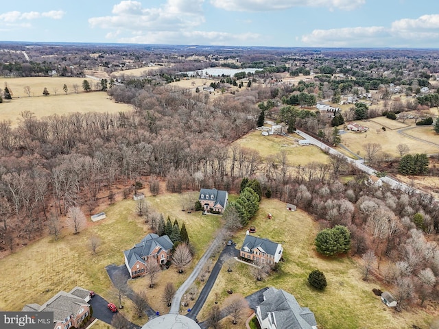 birds eye view of property with a rural view