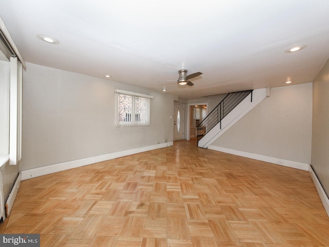 interior space with recessed lighting, ceiling fan, baseboards, and stairs