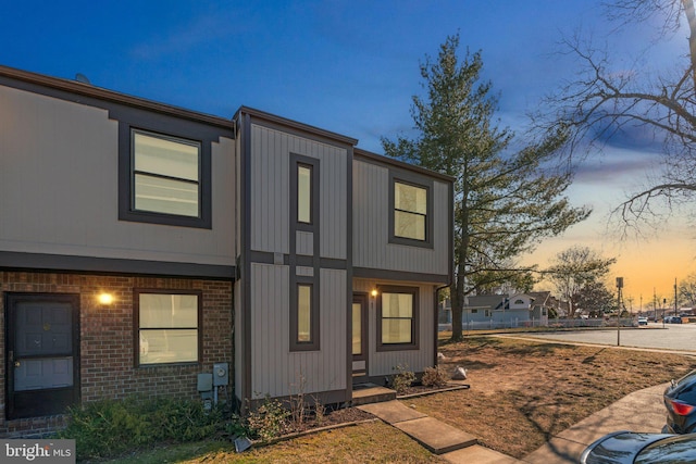 view of front of home featuring brick siding