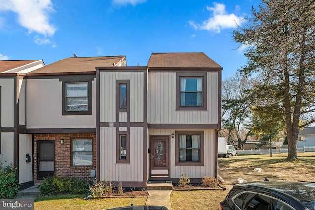 view of property with brick siding