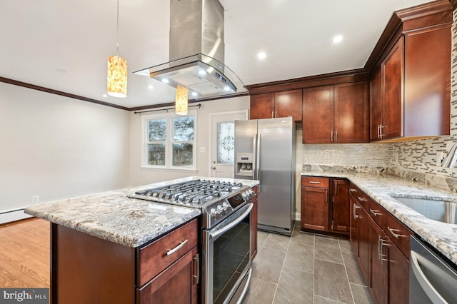 kitchen with island range hood, a sink, appliances with stainless steel finishes, backsplash, and light stone countertops