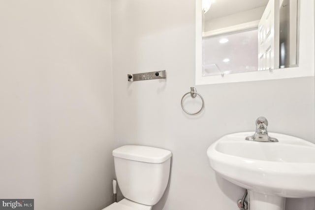 bathroom with a sink and toilet