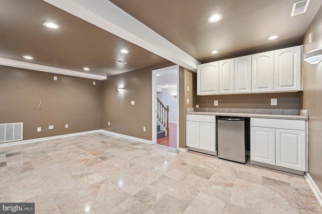 kitchen with recessed lighting, fridge, visible vents, and white cabinets