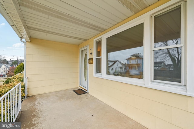 view of exterior entry with concrete block siding