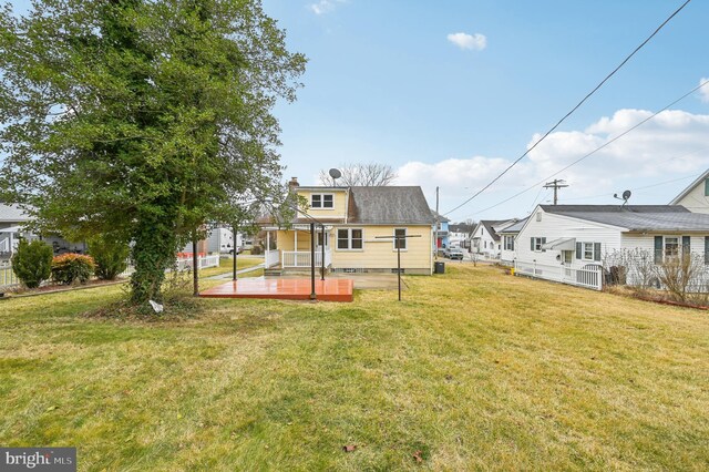 view of yard with fence and a wooden deck