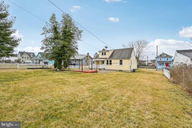 view of yard with a fenced backyard and a wooden deck